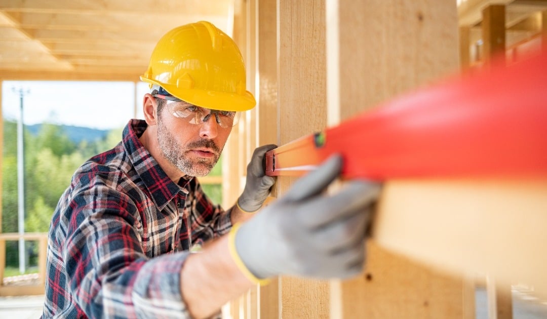 worker-using-level-tool-measure-frame-house-constr-2021-08-28-15-56-12-utc-1